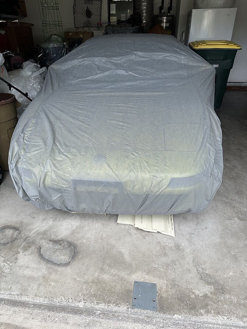 Alcazar A.'s vehicle under its cover, from their review.