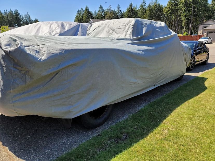 Owner photo from Adrian C.: a pickup truck under a light grey cover on a driveway