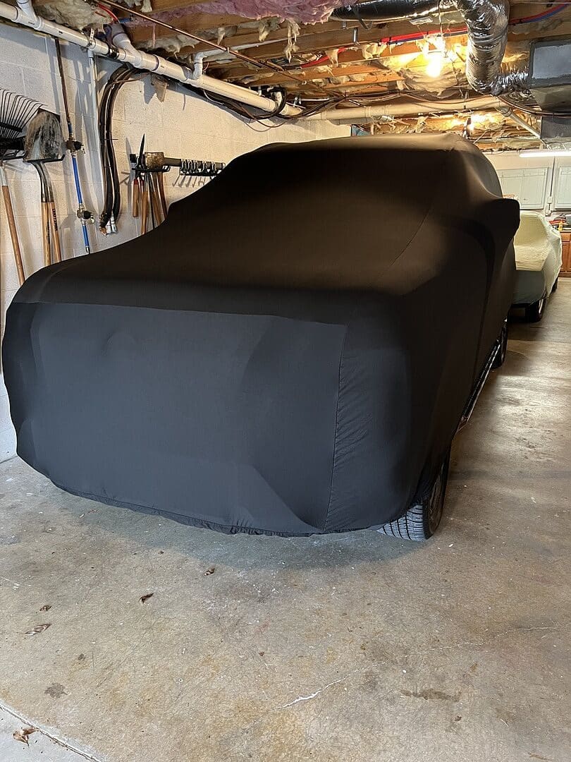 Arland S.'s vehicle under its cover, from their review.