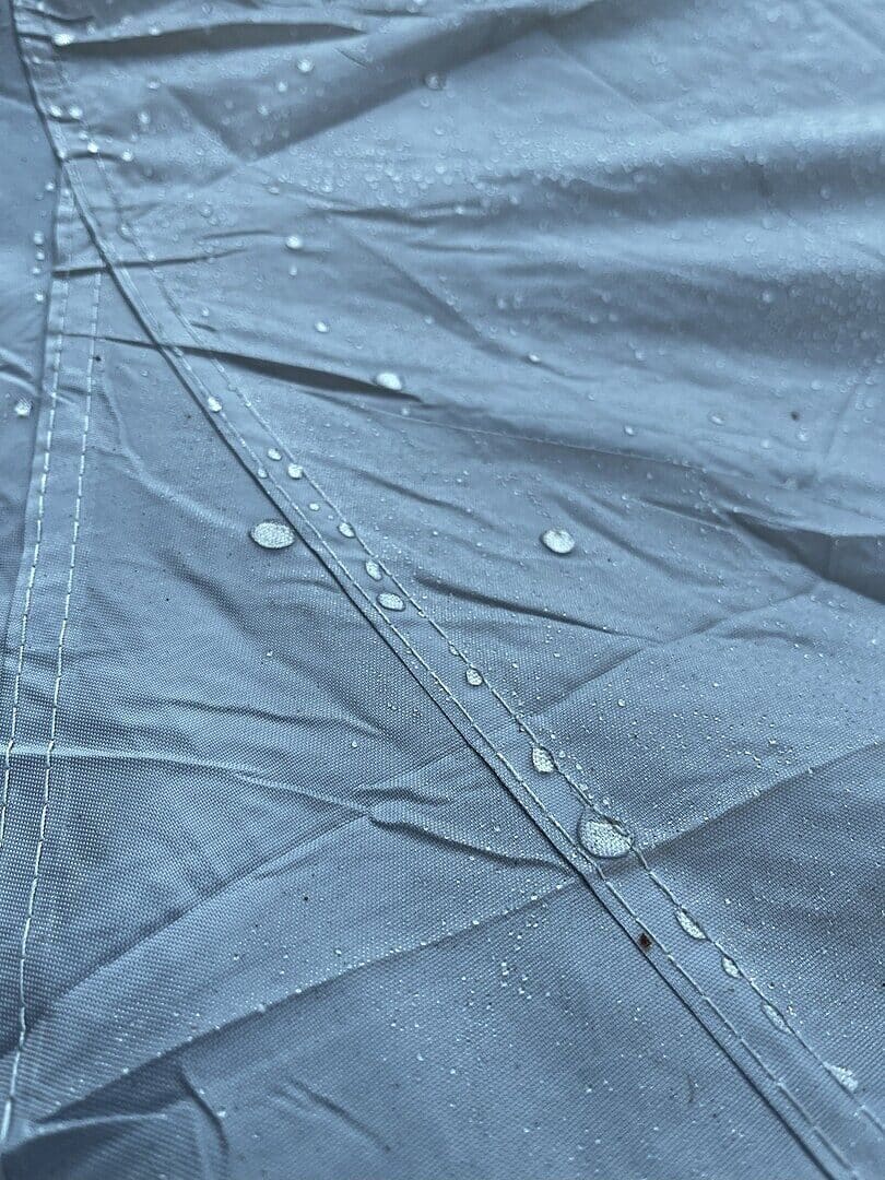 Owner photo from Beverly M.: water beading on the outer face of a grey cover along a seam