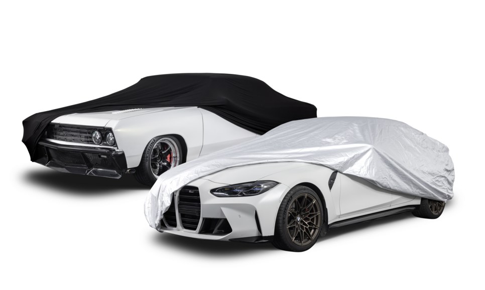 Muscle car and sports car half covered with car covers