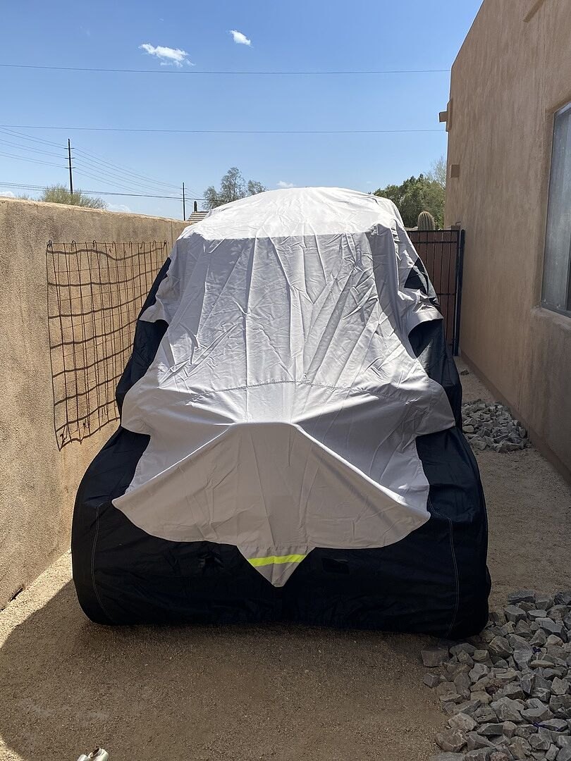 A customer's powersports machine under its CarCovers cover