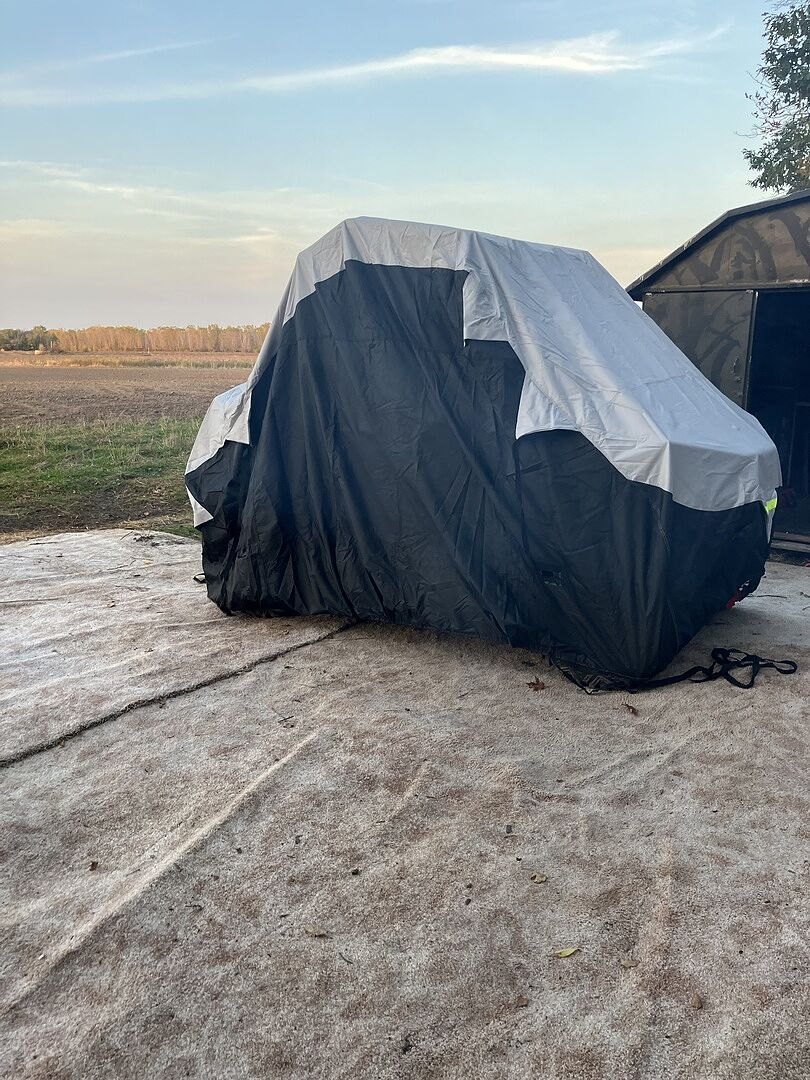 A customer's powersports machine under its CarCovers cover