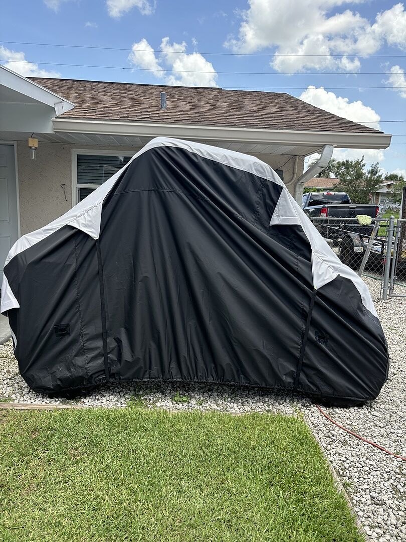 A customer's powersports machine under its CarCovers cover