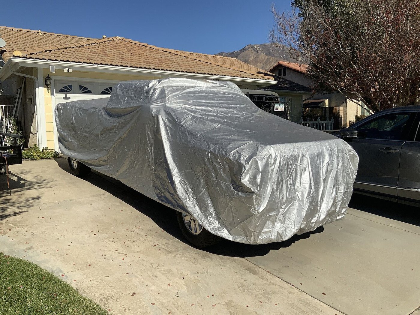 A customer's truck under its CarCovers cover